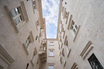 Low angle view of a building with beige stone walls