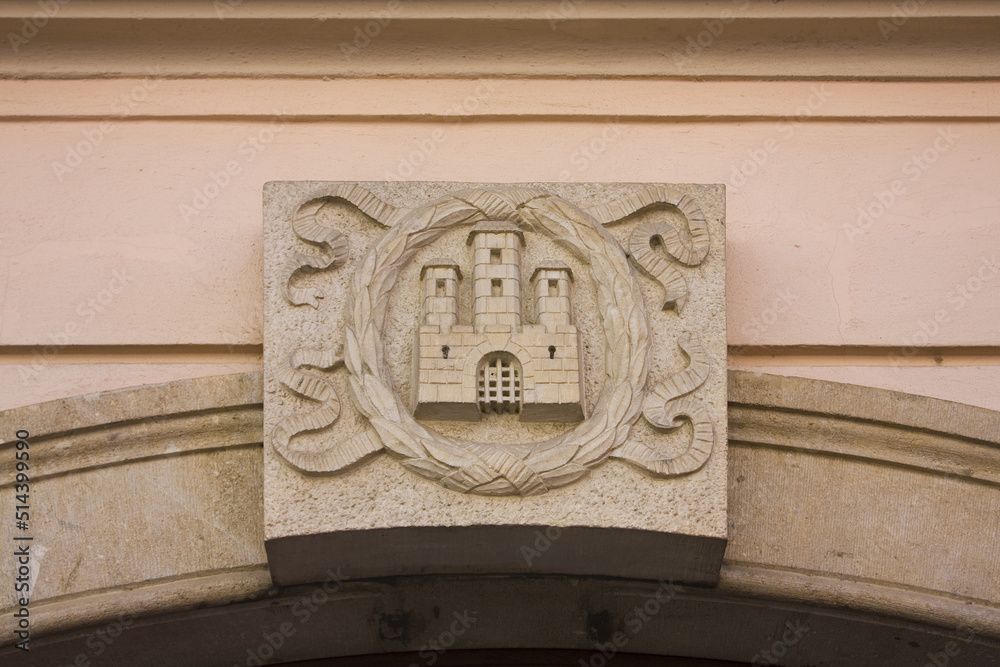 Wall mural city emblem of bratislava in the shape of bas relief on the old building