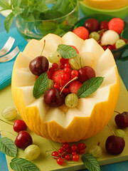 Melon filled with varied fruits.