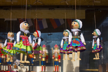 Traditional puppets made of wood at the outdoor market in Bratislava