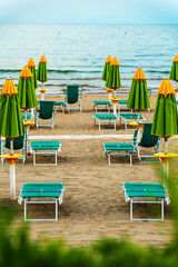 Sun loungers and umbrellas on the private beach.