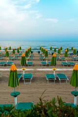 Sun loungers and umbrellas on the private beach.
