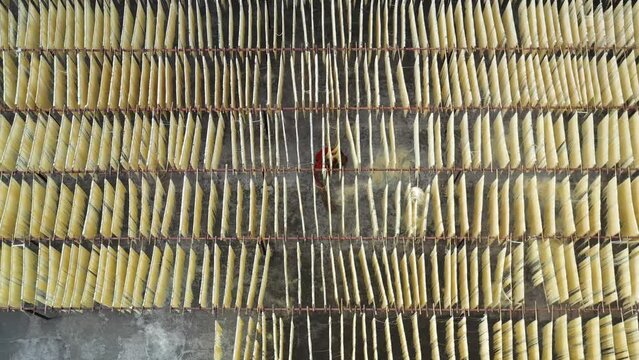 Aerial view of Drying of the natural fibers for the fabric, Barga, Rajshahi, Bangladesh.
