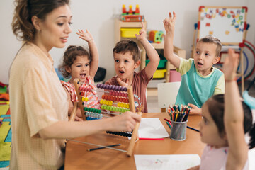 teacher and kids in kindergarten