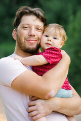 Portrait of a happy young dad and a baby son