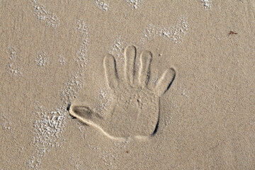 Handprint  in sand