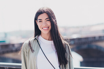 Portrait of nice adorable sweet lady tourist look in camera for picture making in sightseeing tour outdoors