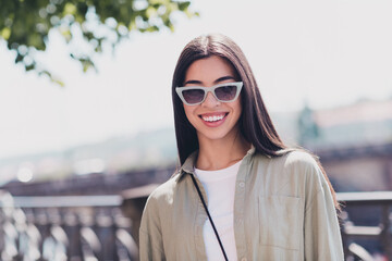 Portrait of adorable cute lady tourist look in camera enjoy architecture excursion landmarks outside