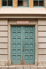 Detail of an exterior timber door painted blue