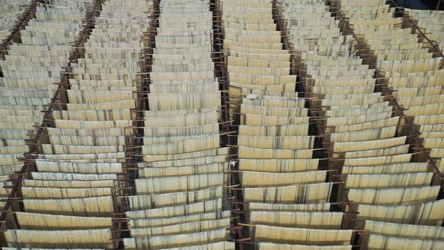 Aerial view of Drying of the natural fibers for the fabric, Barga, Rajshahi, Bangladesh.
