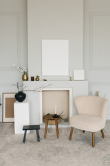 Beautiful interior of a bright minimalist living room with a fireplace and Scandinavian-style armchairs
