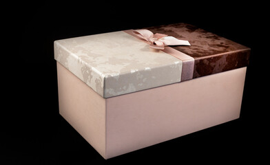 Black friday gift box with pink bow on black background. Copy space. Horizontal, banner, postcard