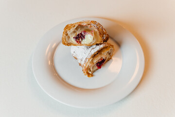 croissant with cherry filling cut in half