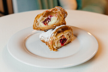 croissant with cherry filling cut in half