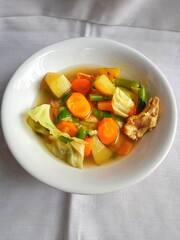chicken and soup on a bowl