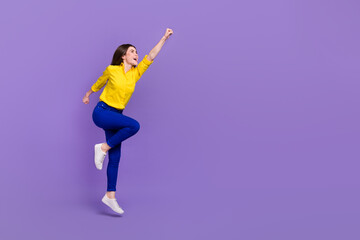 Fototapeta na wymiar Full length body size view of attractive cheery energetic girl jumping striving isolated over bright violet purple color background