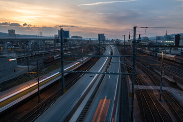 Fototapeta na wymiar High Angle View Of Railroad Tracks Against Sky During Sunset