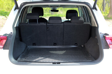 Open tailgate on a luxury estate. Clean, open empty trunk in the car. Open back door modern car....