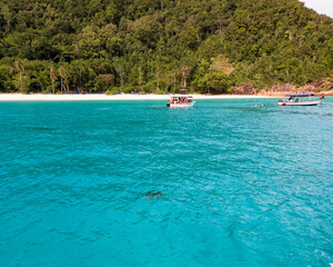 Fototapeta na wymiar Boats, turquoise water and white sand beach, Redang Island, Malaysia