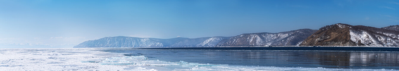 Fototapeta na wymiar Winter landscape panorama with mountains and Lake Baikal in Siberia on sunny day. Natural background.