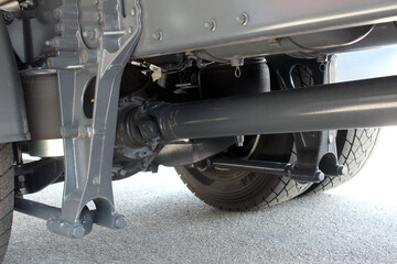 Truck driveshaft. Closeup of a car cardan drive shaft. Truck shaft axle of power transmission to...
