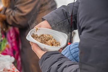 feeding homeless military refugees who fled their homes during the bombing of civilians