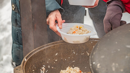 feeding homeless military refugees who fled their homes during the bombing of civilians