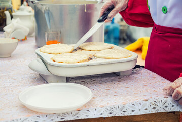 cooking flatbread on the street to feed the homeless refugees