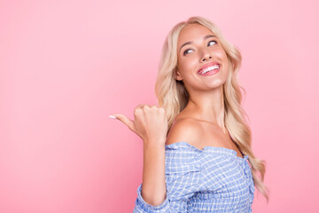 Photo of cute thoughtful lady wear off shoulders top looking pointing thumb back empty space...