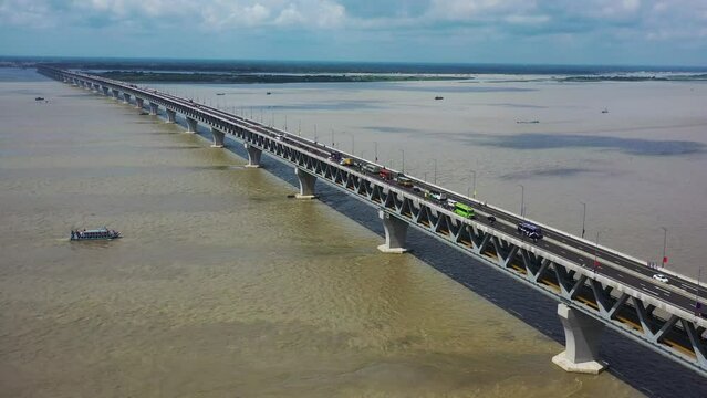 Aerial view of Padma bridge, over the Padma river by day in perspective, Shibchar, Dhaka, Bangladesh.