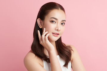 Fototapeta premium Beautiful young asian woman with clean fresh skin on pink background, Face care, Facial treatment, Cosmetology, beauty and spa, Asian women portrait.
