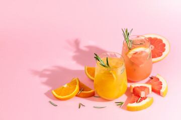 Summer cocktails with grapefruit, orange, rosemary, and ice.