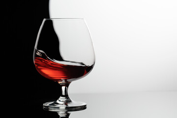 Splash of brandy in a snifter glass.