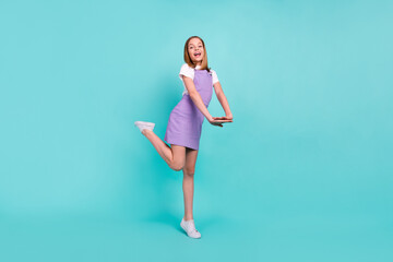 Full body photo of cheerful positive girl have good mood toothy smile isolated on teal color background