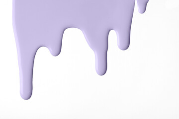Light purple liquid drops of paint color flow down on isolated white background. Abstract violet backdrop