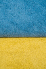 Fototapeta premium A roll of blue and yellow leather. Ukrainian leather production. Factory for sewing shoes in Ukraine