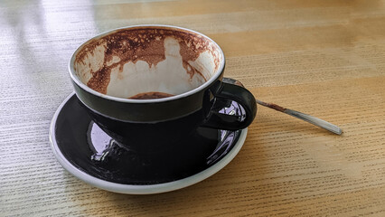 Empty coffee cup on the table. Restaurant morning drink.  Caffeine aromatic espresso.