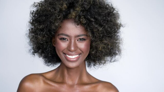 Smiling black woman with curly hair