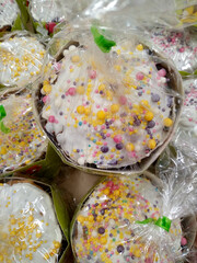 Top view of easter cakes from the supermarket in a package decorated with a multi-colored sprinkling