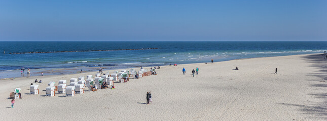 Panorama of traditional chairs on the beach of Sellin, Germany