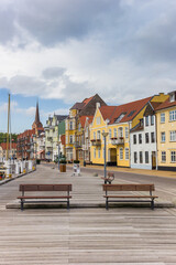 Benches at the wooden jetty in the harbor of Sonderborg, Denmark