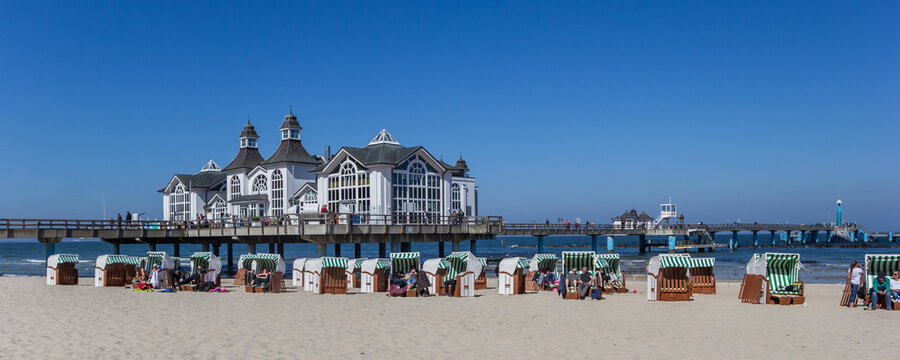 Panorama of beach chairs in front of the sea bridge in Sellin, Germany