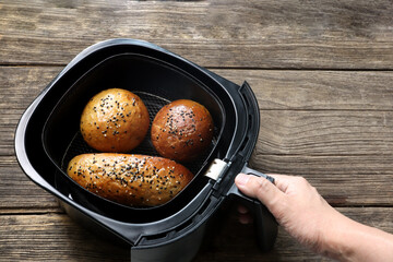 homemade organic butter bread  are baked by using a black air fryer or oil free fryer appliance for...