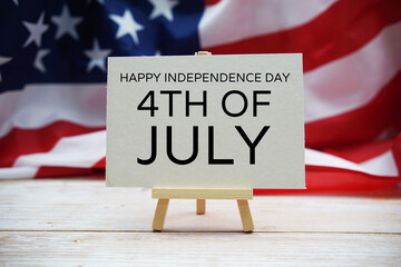 Happy Forth of July Independence Day text messege  with USA flag on wooden background