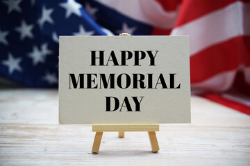 Happy Memorial Day text messege  with USA flag on wooden background