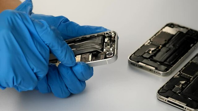 Technician repairing the camera on phone parts and tools for recovery repair phone smartphone and upgrade mobile technology,the concept of computer hardware inside. concept of data, hardware