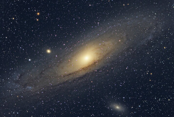 The Andromeda Galaxy, also known as Messier 31 and the satellite galaxies M32 and M110. Star map of...