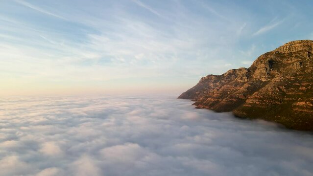 Aerial view of False bay covered in low cloud sunrise, Simonstown, Cape Town, South Africa.