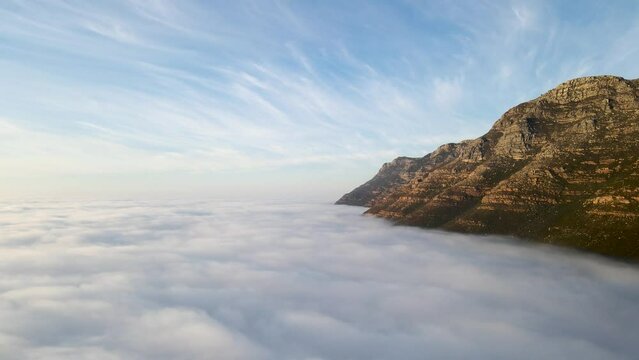 Aerial view of False bay covered in low cloud sunrise, Simonstown, Cape Town, South Africa.