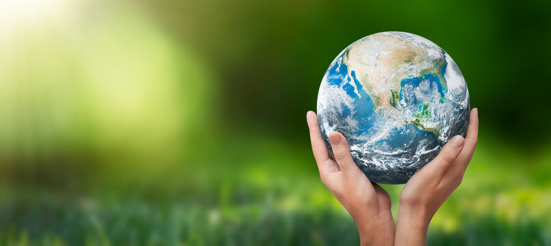 Hands raised to Earth. Environment protection